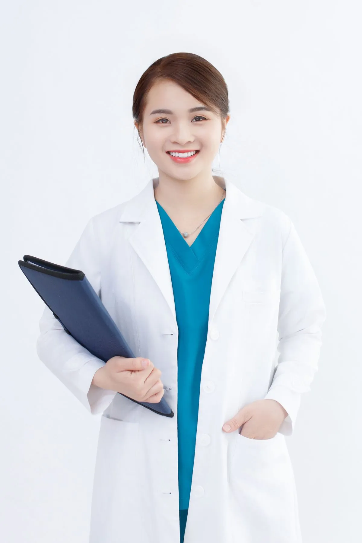 Portrait of Sofia, a licensed esthetician in a white coat